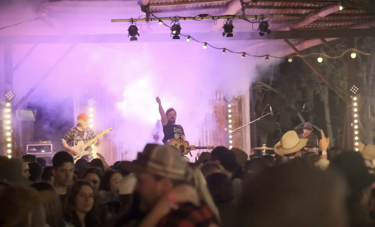 A big crowd in front of The Barnyard Band at a Queensland rodeo