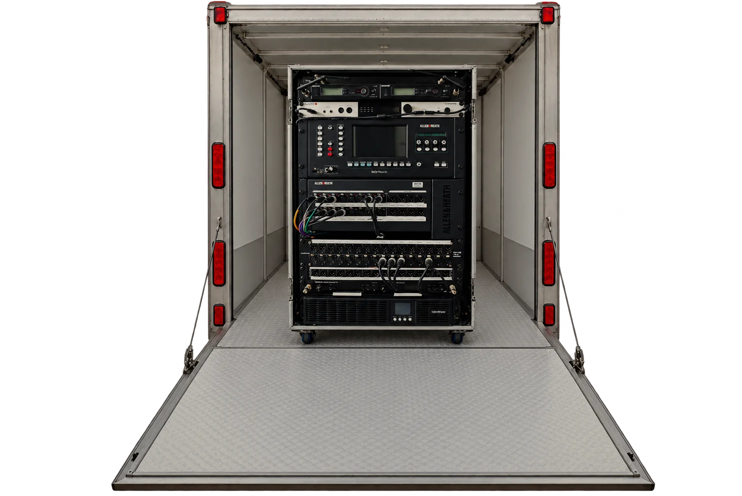 The trailer open, ramp down, with the band's Allen & Heath SQ rack inside