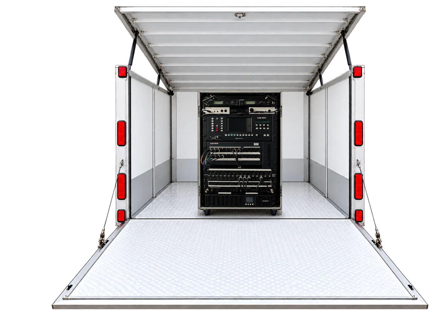 The trailer open, roof up and ramp down, with the band's Allen & Heath SQ rack inside